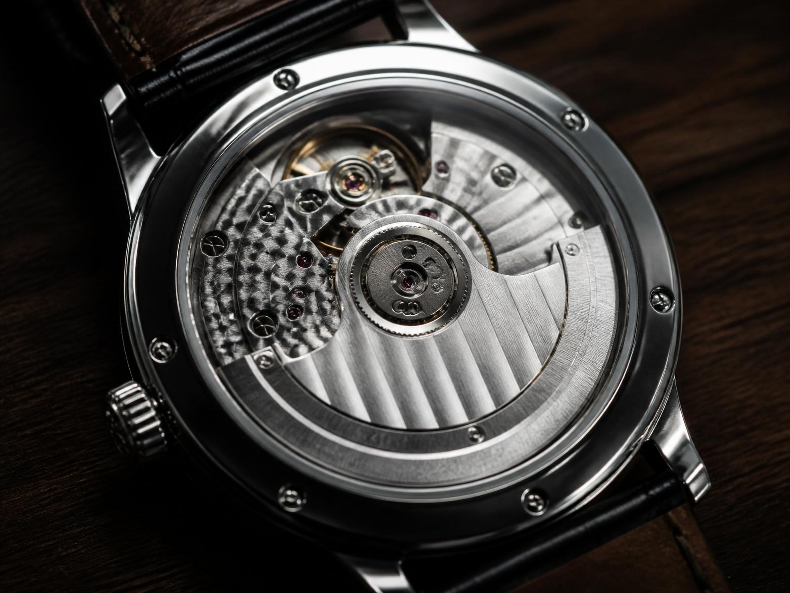 Exhibition caseback revealing the decorated Japanese automatic movement